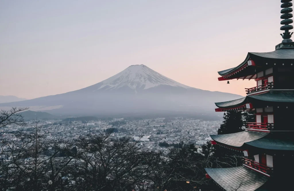 Mount Fuji beyond a traditional pagoda in Japan