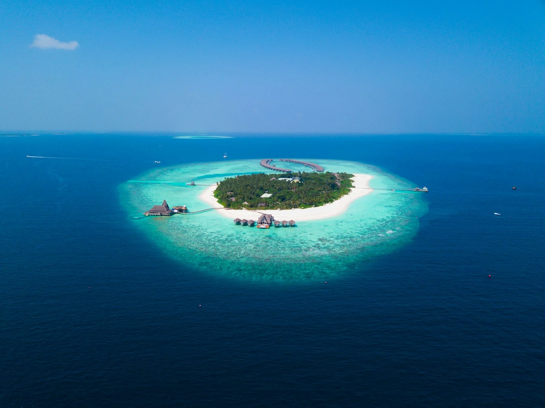 Clear turquoise water around a quiet island in the Maldives