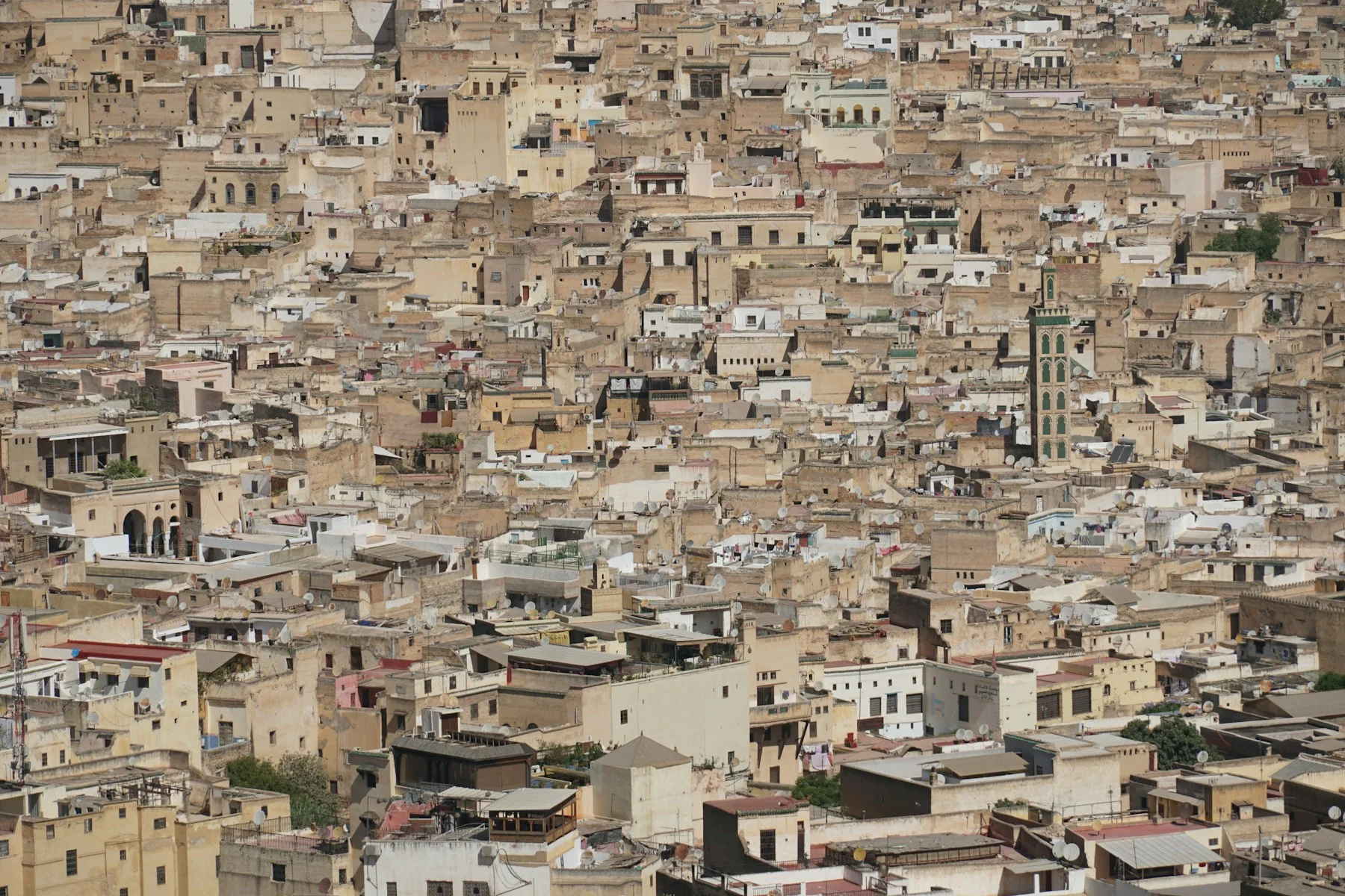A minaret above the rooftops of Fes, Morocco