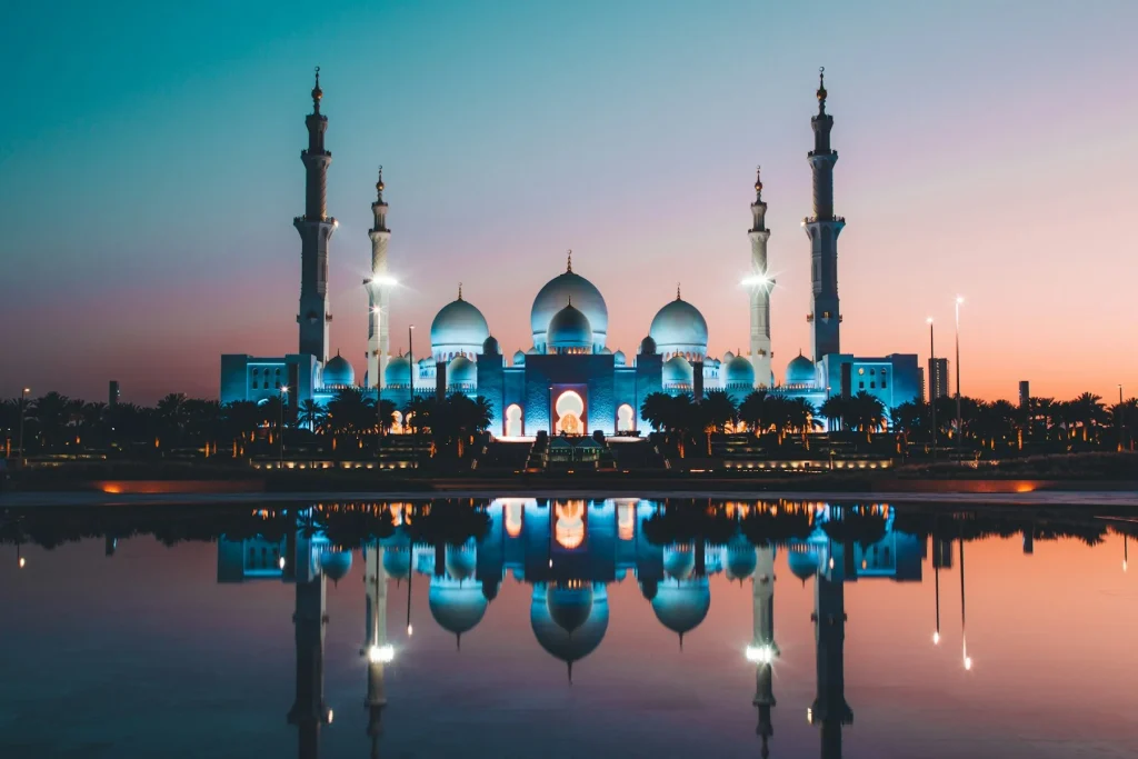 Sheikh Zayed Grand Mosque reflected in water in Abu Dhabi