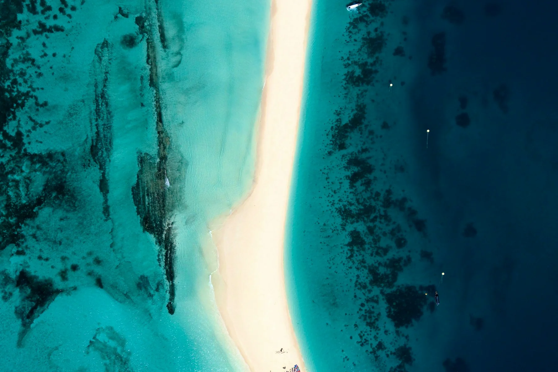 A sandbank and boats in the turquoise waters of Zanzibar